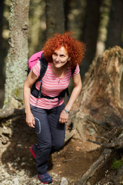 istock Woman hiking on a trail 974280480