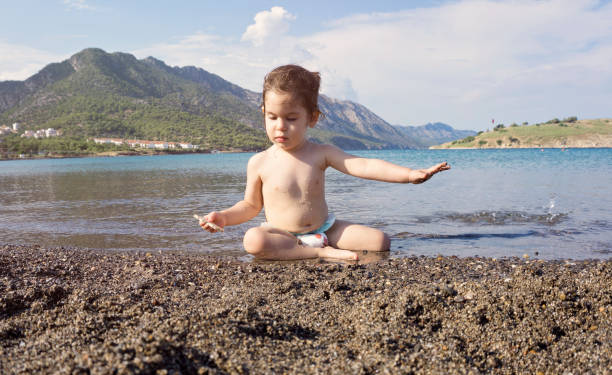 Little boy is having fun on a beach
