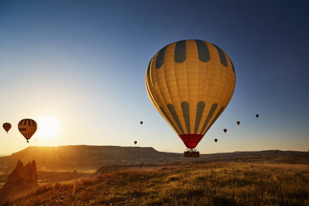 istock Hot Air Balloons Flying at Sunset, Cappadocia, Turkey 974294894