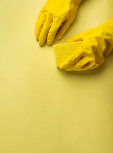 istock Kitchen sponges and rubber gloves 974299882