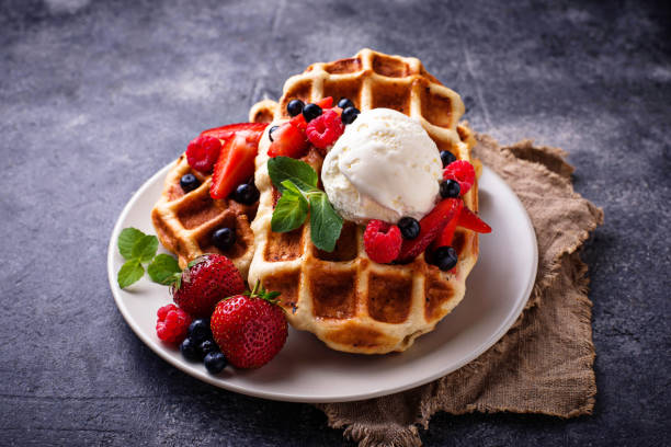 Belgium waffles with berries and ice cream stock photo