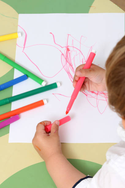 istock hand of a child who draws 974305996