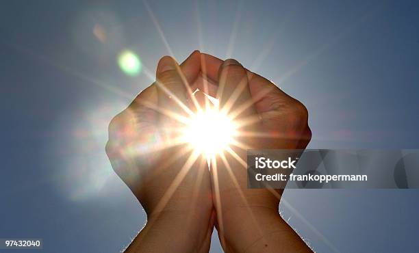 Looking Up At Two Hands Cupping The Sun Stock Photo - Download Image Now - Determination, God, Aspirations