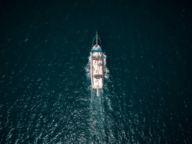 Yacth cruising along the open sea stock photo