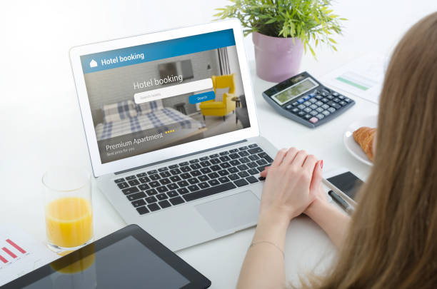 istock Person booking hotel room on laptop 974330056
