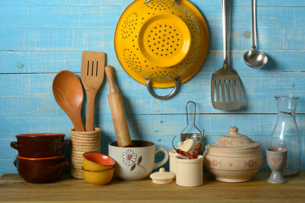 istock pile of kitchen utensils on light blue background - horizontal 974330782