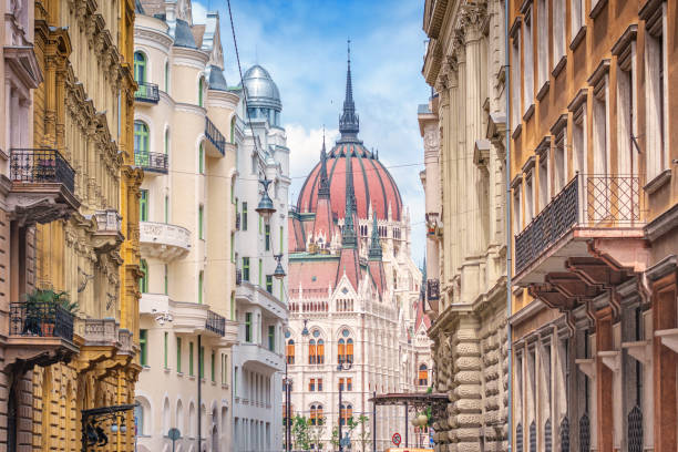 parliament building and ornate townhouses in budapest hungary - hungary imagens e fotografias de stock