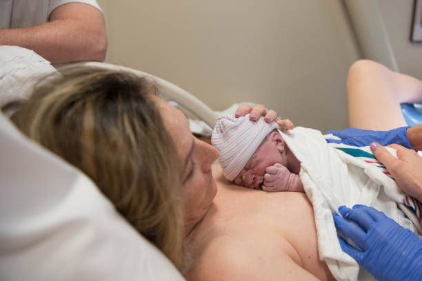 istock New baby put on Mom's chest after birth 974363428