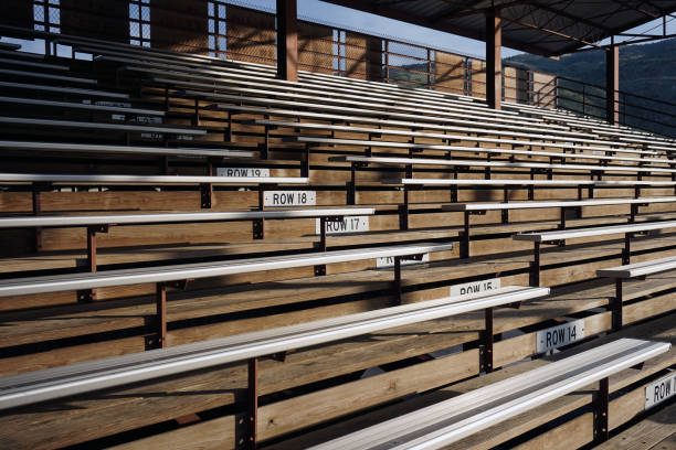 Wooden bleachers. Empty wooden bleachers with metal seat covers. wooden bleachers stock pictures, royalty-free photos & images