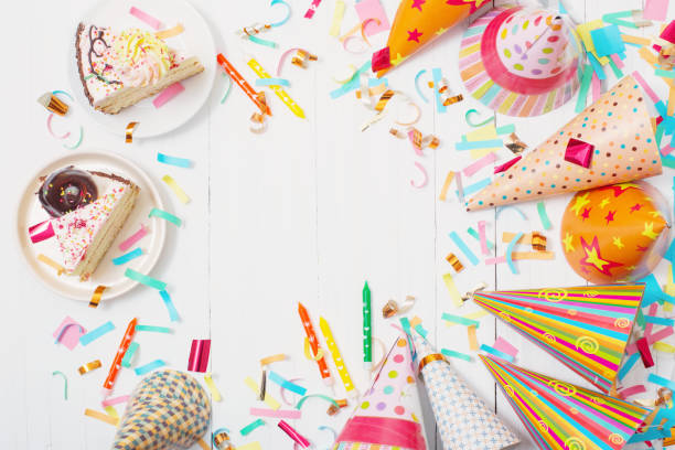 istock birthday cake and  decoration on white wooden background 974378210