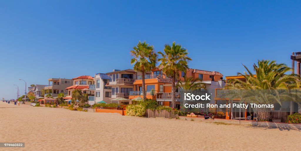 Mission Bay beach houses on sand in San Diego, California(P) beach house with sand, beach house with palm trees, Mission Bay beach house, San Diego Stock Photo