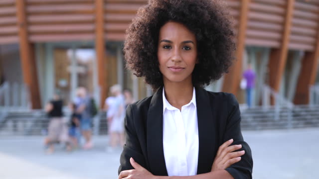 Portrait Of Confident Business Woman Posing Outside Of Business Building In Milan, Italy