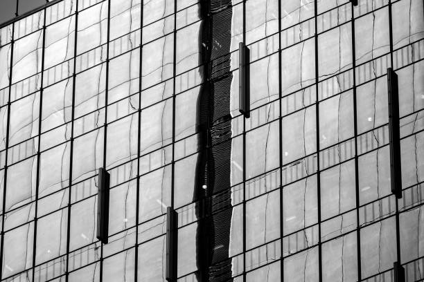 istock Modern office building detail, glass surface with B&W color 974485776