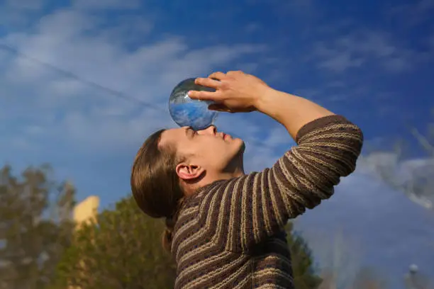 Photo of Contact juggling. Performance on street