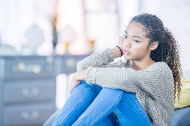 istock Sad Girl At Home 974533588