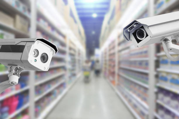 istock CCTV Security camera shopping department store on background. 974534568