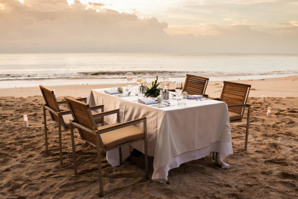 istock dinner table on the beach at Thailand 974562250