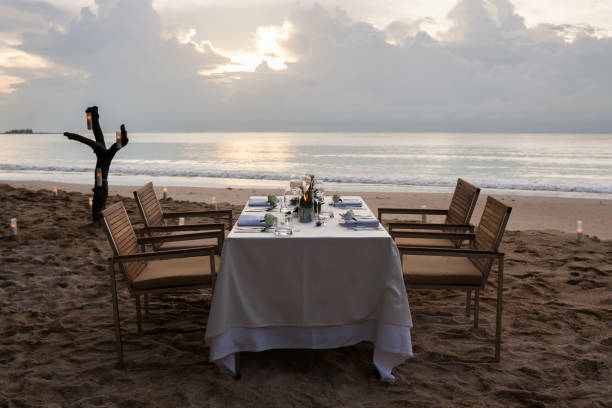 istock dinner table on the beach at Thailand 974562414