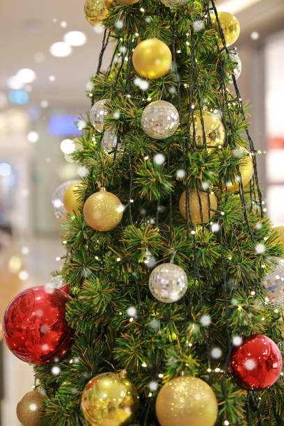 istock Christmas tree and decorations on white background with bokeh. 974573892