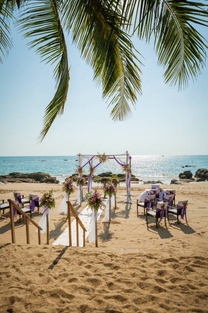 istock wedding flowers setting on the beach 974597284