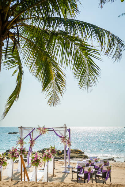 istock wedding flowers setting on the beach 974597396