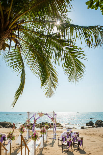 istock wedding flowers setting on the beach 974598116