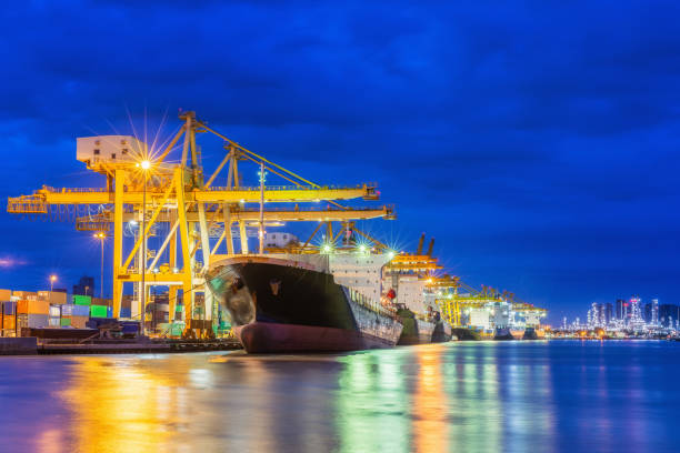 istock Harbour with ship and crane for logistic or shipping concept background. 974600918