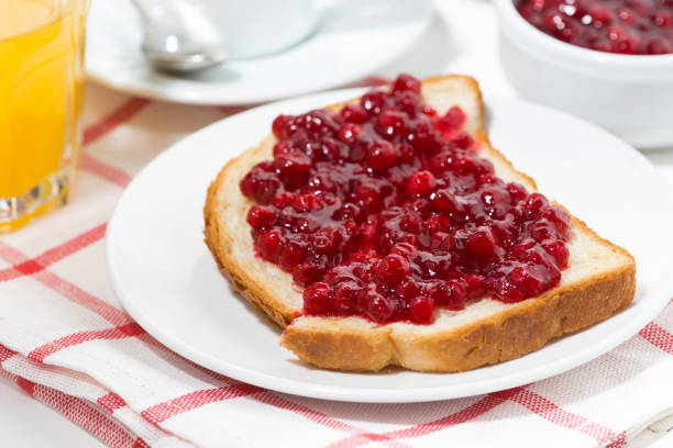 toast with cranberry jam for breakfast, closeup