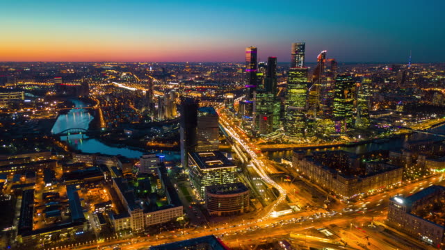 sunset sky night illuminated moscow city traffic street aerial cityscape panorama 4k time lapse russia