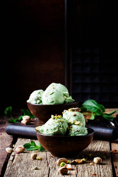istock Pistachio ice cream with mint leaves 974617636