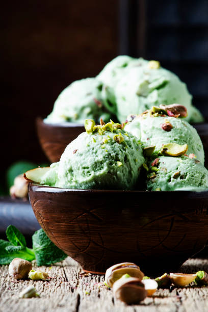 istock Pistachio ice cream with mint leaves 974617938