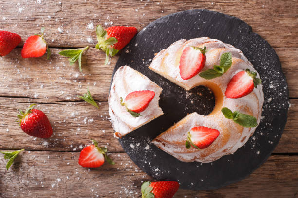 istock Pound Cake cake with mint and strawberry close-up. horizontal top view 974621216