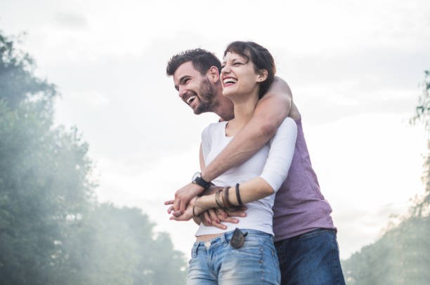 istock Young couple having fun on the beach 974621336