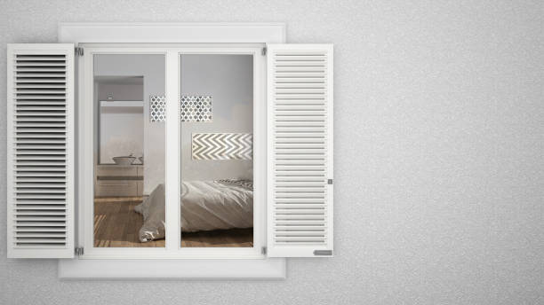 istock Exterior plaster wall with white window with shutters, showing interior modern bedroom, blank background with copy space, architecture design concept 974627326