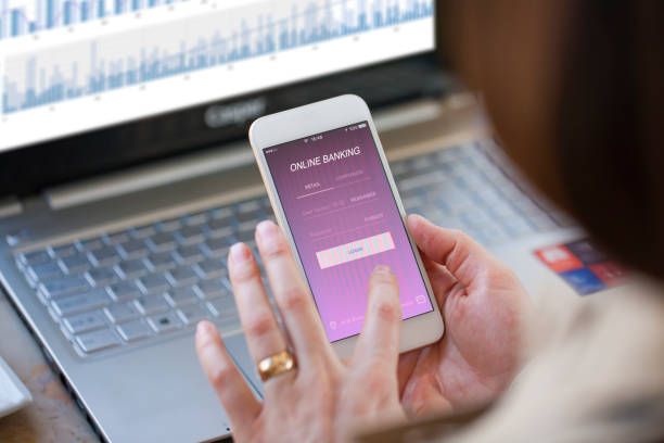 istock Businesswoman using online banking on smartphone 974627340