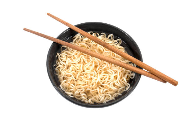 istock Noodles in bowl with chopsticks isolated on white background 974630486