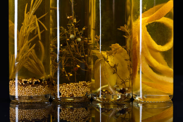 bottles of olive oil with warious spices and herbs.