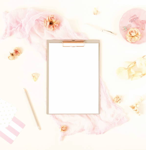 istock Creative festive composition with  frame mock up, pink blanket, flowers, eucalyptus branches, roses on white background. Flat lay, top view stylish template. 974630982