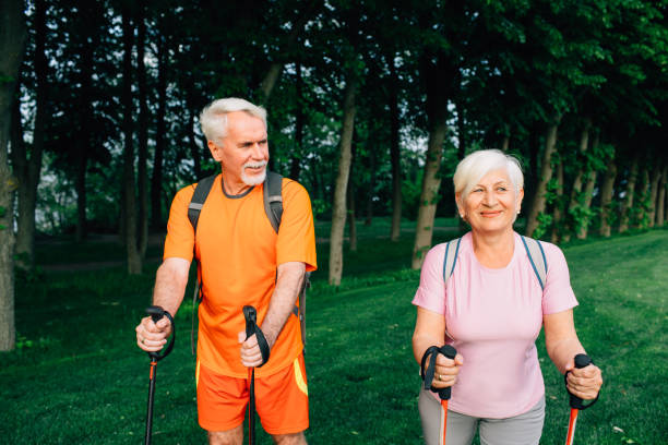 istock Senior couple hiking below trees, active lifestyles 974637018