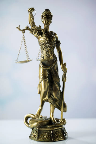 istock Goddess of justice on a light background 974637102