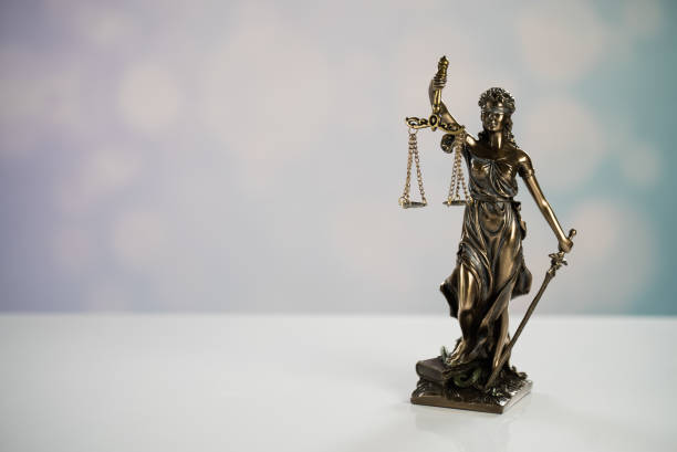 istock Goddess of justice on a light background 974637114