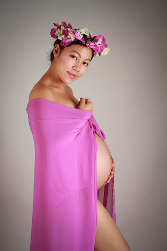 Sexy and Fantasy maternity photoshoot in a studio.
