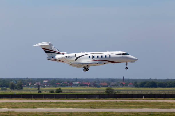 P4-AGL Bombardier Challenger 350 (BD-100-1A10) business jet aircraft landing on the runway stock photo