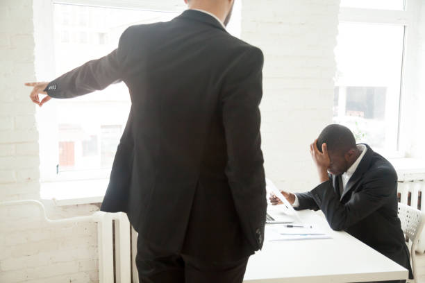 Angry employer asking fired African American worker to leave