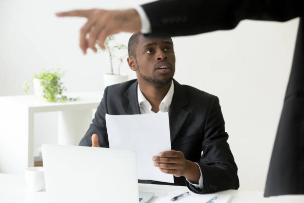 istock Frustrated African American worker being fired and asked to leav 974640988