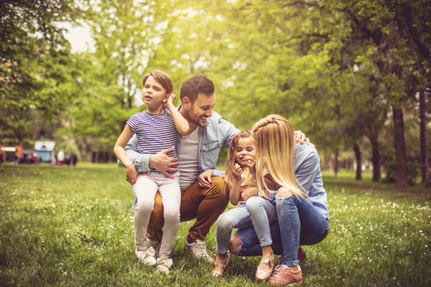 istock Cheerfully family at park. 974647176