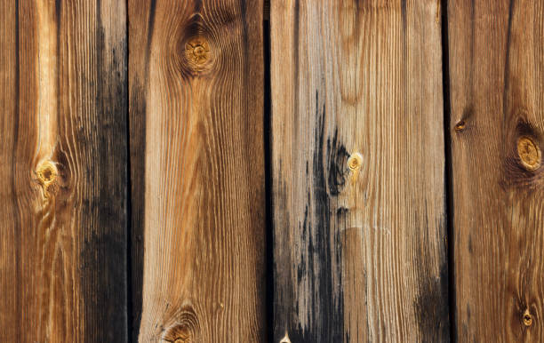 istock Brown-black wooden boards, texture, background 974651028