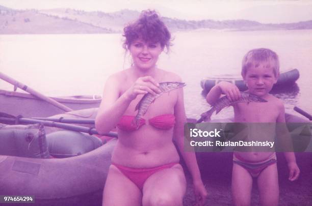 Mother And Her Son Fishing Pikes On Lake Stock Photo - Download Image Now - Photography, Family, Vacations