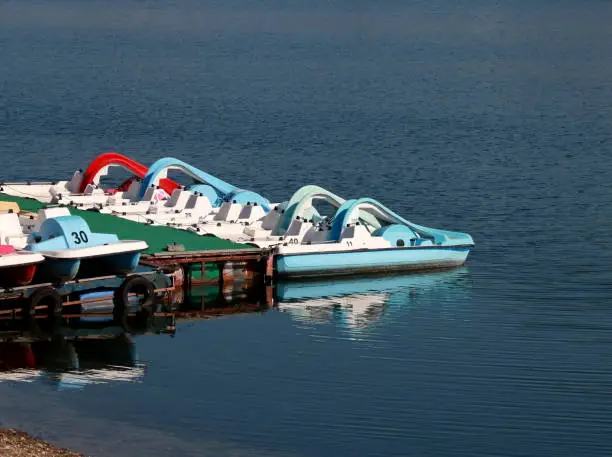 Pedal-boats with water slides on the sea.