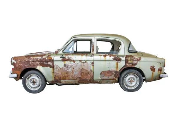 Photo of Old rusty classic car isolated on white background.Old rusty ancient car isolated